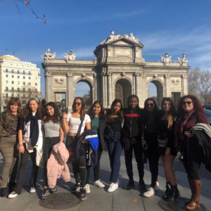 A group of sixth-form pupils standing in front of a monument in Madrid.